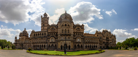 Majestic Lakshmi Vilas Palace under a bright sky.