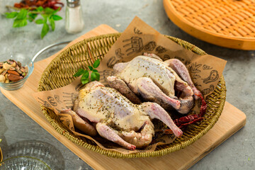 Raw squabs, fresh raw pigeon ready for cooking and stuffing.