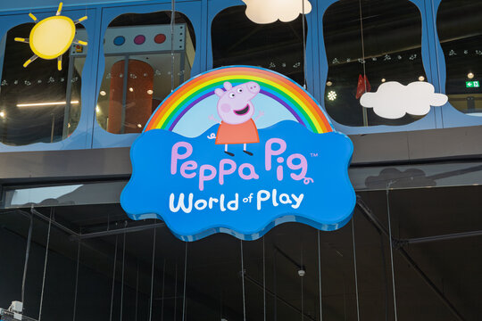 The vibrant "Peppa Pig World of Play" sign welcomes visitors to a fun, interactive children's attraction, perfect for family entertainment. Leidschendam, Netherlands, 31 May 2025.