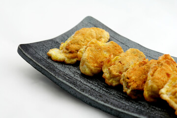 Pan-Fried Korean Oyster Pancakes on Ceramic Plate