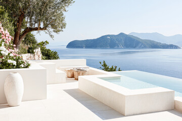 Fototapeta premium Scenic view from modern villa overlooking tranquil sea and distant island at midday