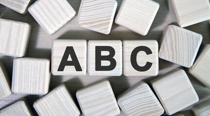 ABC - text on wooden cubes and many cubes around