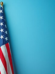 Patriotic American flag corner on soft blue background providing elegant copy space, ideal minimalist image for Memorial Day, Fourth of July greetings, or veteran tributes.
