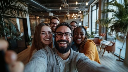 Joyful Diverse Team Selfie in Modern Office Space: Celebrating Collaboration and Success