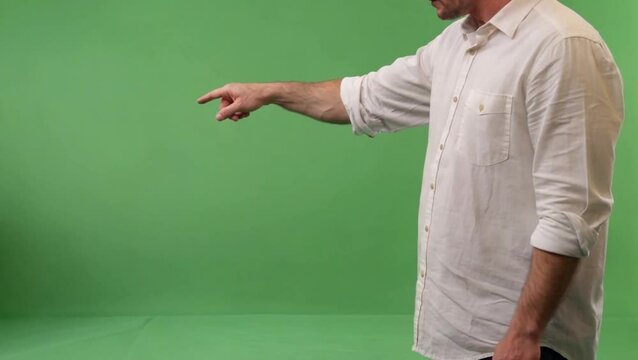 Person Pointing Sideways on Plain Green Screen for Promotions