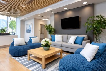 Modern waiting room with comfortable blue seating, sofa, tv and plants