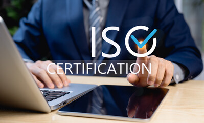 ISO Certification Approval Concept, Businessman Highlighting ISO 9001 Compliance with Glowing Check Mark, Global Standards and Quality Assurance in Corporate Management
