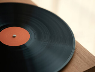 A blank, black vinyl record ready for audio recording.