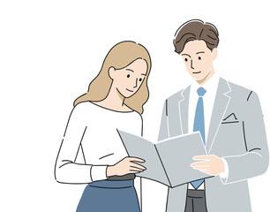 Two smiling businesspeople in suits are talking in an office