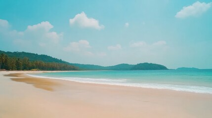 Pristine beach scene under a clear, sunny sky.