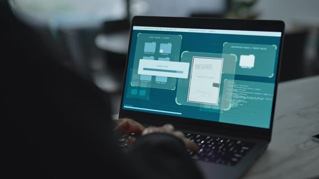 Hacker using laptop computer copying files and secret documents in remote server. Spy type on keyboard breaking into system with special access software or malware. Classified information compromised