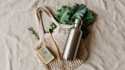 Eco-Friendly Essentials: An eco-conscious assortment, featuring a sustainable toothbrush, fresh produce, and a reusable water bottle, all nestled within a natural tote bag.