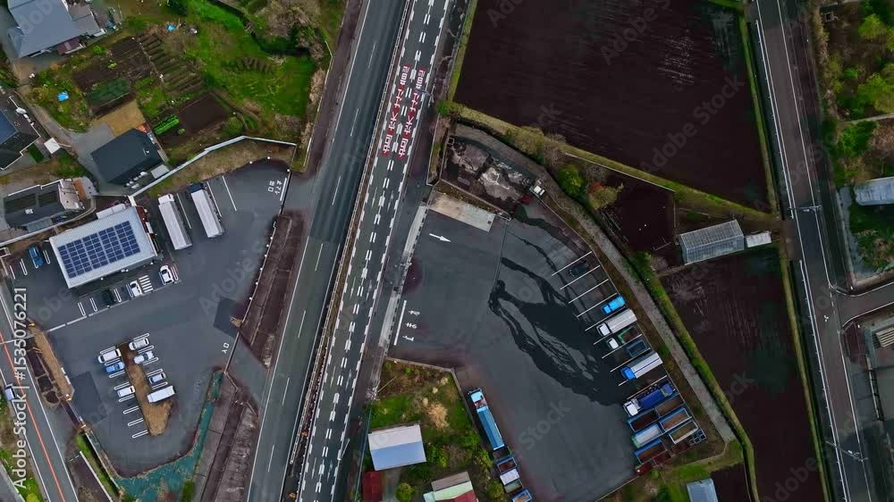 Poster Directly above aerial view of the highway running through the plains