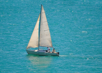 Sailing yacht race at sun light aerial. Yachting on serene seascape at open sea. Boat with big...