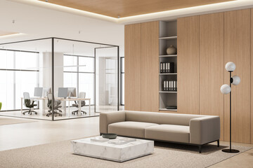 Modern office interior with beige sofa and marble coffee table in front of glass meeting room and...