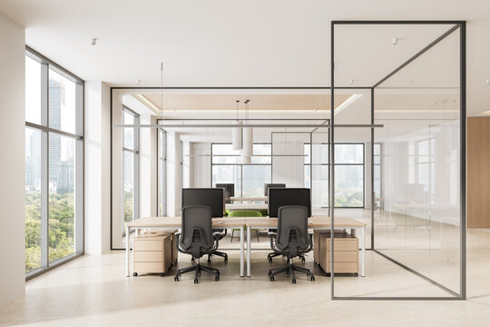 Modern open-plan office interior with glass partitions, ergonomic chairs, wooden desks, and panoramic city view in high-rise building. 3D Rendering