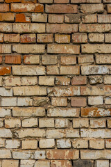 Weathered brick wall showing age and rustic charm outdoors