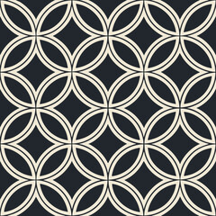 Fototapeta premium Lattice geometric seamless vector pattern of interconnecting circles in black and cream design 