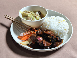 Goulash satay. Sate gulai is a traditional Indonesian culinary menu, curry satay cooked using spices.