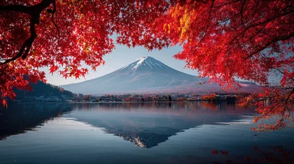 Stunning photo of serene mount fuji reflection in calm lake kawaguchiko waters framed by vibrant red maple leaves autumn scenery peaceful japanese landscape travel destination.