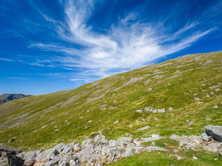 View of green slopes and majestic clouds (Scafell Pike, Lake District, England, United Kingdom)