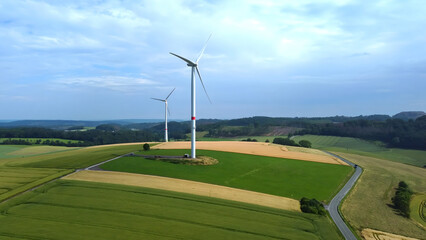 Green Energy Sauerland: Drone view of wind turbines and farmland