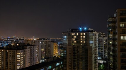 Fototapeta premium Cityscape at night, lights of high-rise buildings