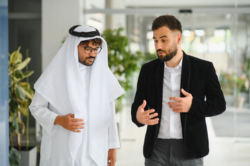 International business meeting between western and saudi arabian businessmen