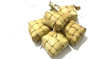Traditional ketupat woven from young coconut leaves, commonly served during Eid al-Fitr and festive celebrations in Indonesia. Cultural food background.