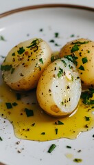 Close-up of boiled potato with olive oil and herbs on minimalist plate