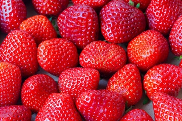 random arrangement of strawberries creates a visually appealing rich texture