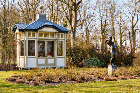 Tea house and bronze garden statue at Borg Verhildersum in Leens