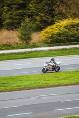 Fototapeta premium Motorbike and scenic roadway in autumn setting