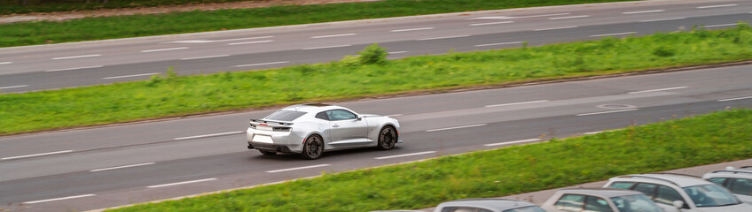 Fototapeta premium Silver sports car driving on highway