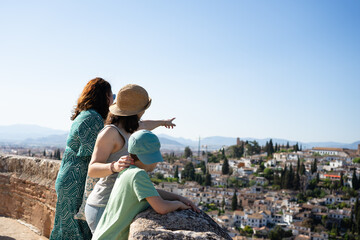 Family enjoying panoramic view of granada, spain