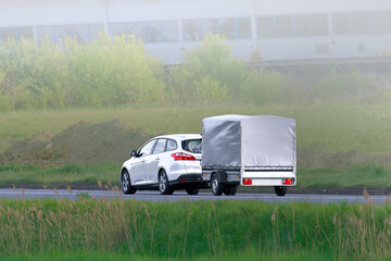 Open road towing with white trailer