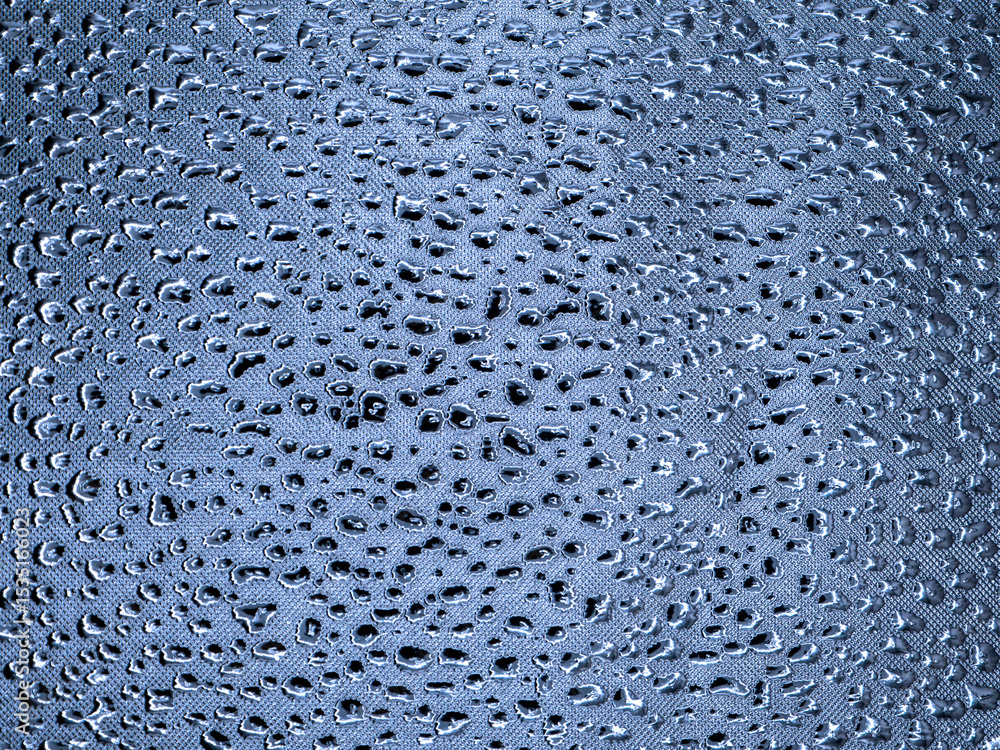 Poster abstract monochrome metallic blue gray texture. many dents of various shapes and sizes on a shiny ba
