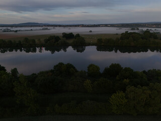 Aerial Drone view of Soane river in France in morning fog at sunrise