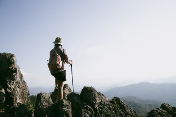Woman hiker on top of mountain. Hiker with arms up on top of mountain successful young woman...