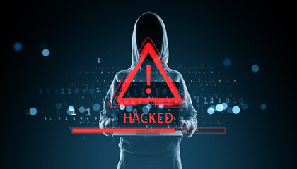 Hacker in hoodie with red warning exclamation mark and "HACKED" alert on screen, digital binary interface on dark background concept..
