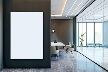 Vertical blank poster mockup on dark wall in modern corporate boardroom with glass walls,...