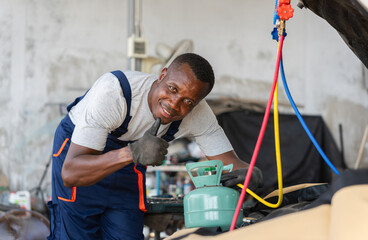 Technician Showing Thumbs Up and Check Car Air Conditioning System Refrigerant Recharge, Mechanic with AC Refrigerant Manifold Gauge Set Repair Car Air Conditioning in Workshop