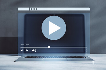 Transparent video player interface overlaying a laptop screen on a modern office desk, symbolizing...
