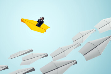 Businessman in yellow paper plane leading white planes on light blue background, symbolizing...