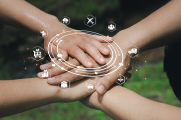 Hands Joining Together with Digital Icons Symbolizing Cooperation and Unity