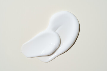 White cosmetic cream texture, skincare lotion swatch on light beige background. Face creme, body...