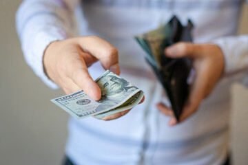 Man gets money from the wallet