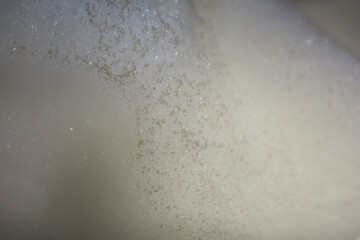 Macro Close-up of Sparkling White Foam Texture with Glittering Details