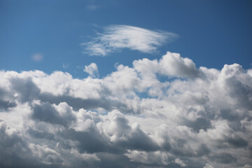 Scenic View of Fluffy Clouds Against a Bright Blue Sky on a Sunny Day