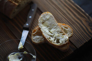 Rustic Bread Slice with Butter on Wooden Table